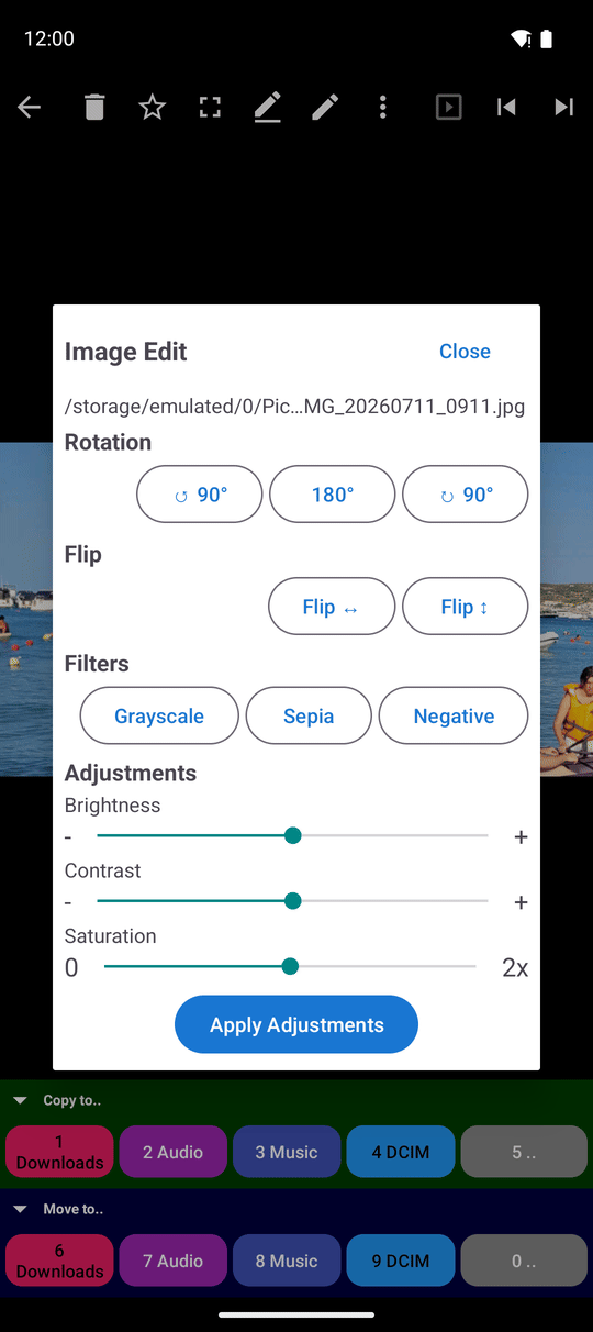 The Image Edit window over a photo, showing rotation, flip, filter buttons and the brightness, contrast and saturation sliders