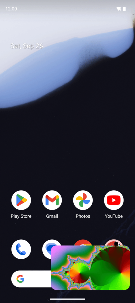 A video playing in a small picture-in-picture window over the Android home screen