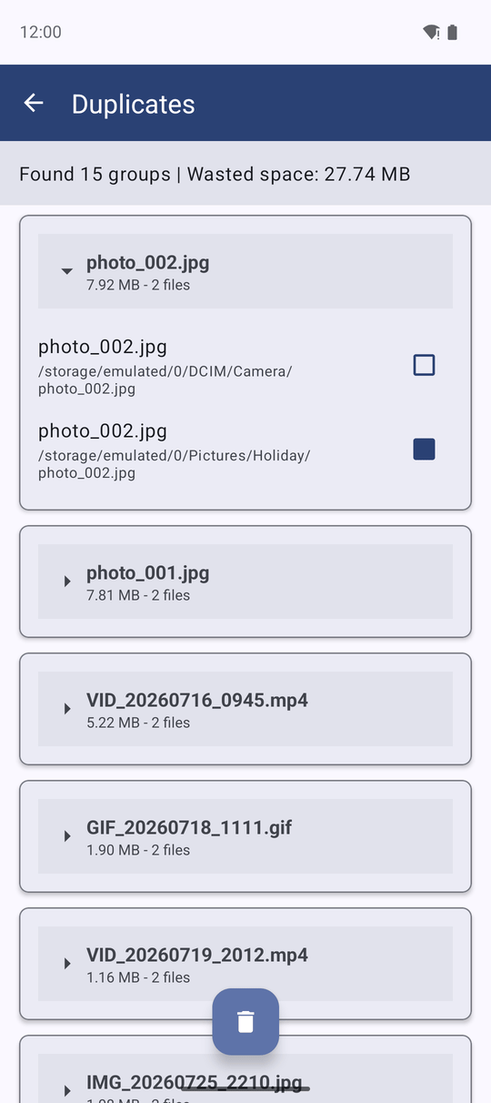 The Duplicates result with groups of identical photos, each group showing its file count and wasted space, all copies except the oldest ticked